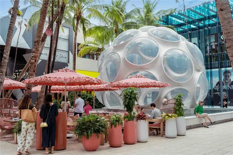 an outdoor space with lots of potted plants