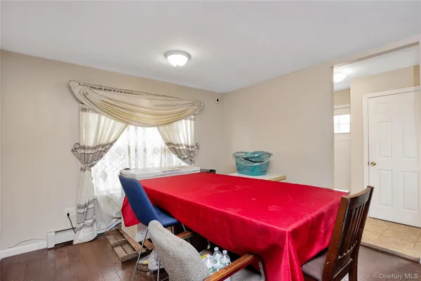 a view of a dining room with furniture and window