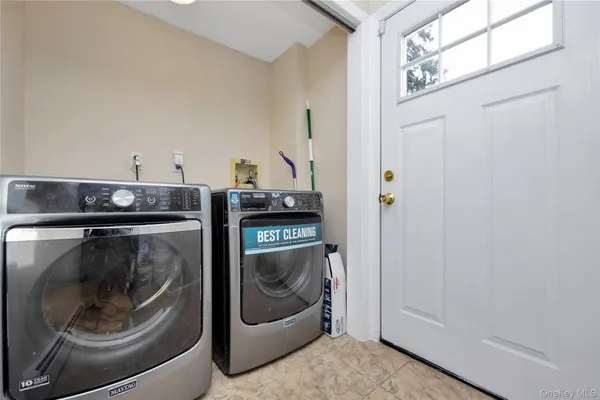 a utility room with washer and dryer