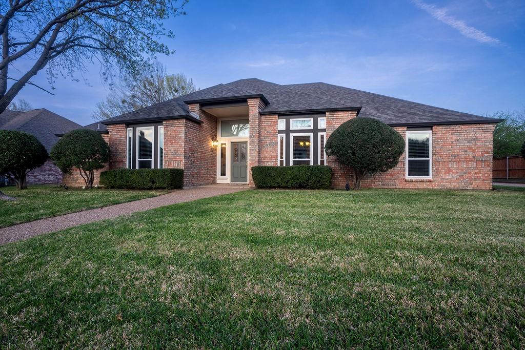 1109 Mockingbird Lane Keller, TX 76248 - Photo 1 of 1 View of front of home with roof with shingles, a front yard, and brick siding