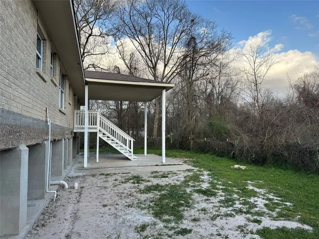 a backyard of a house with lots of green space