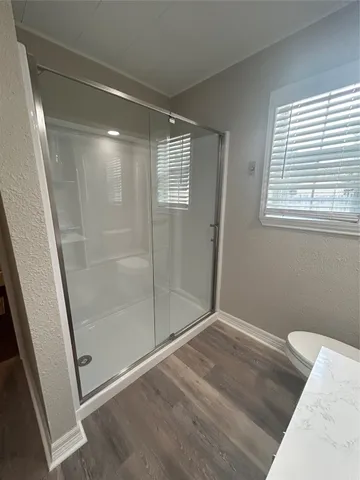 a bathroom with a bathtub sink and toilet