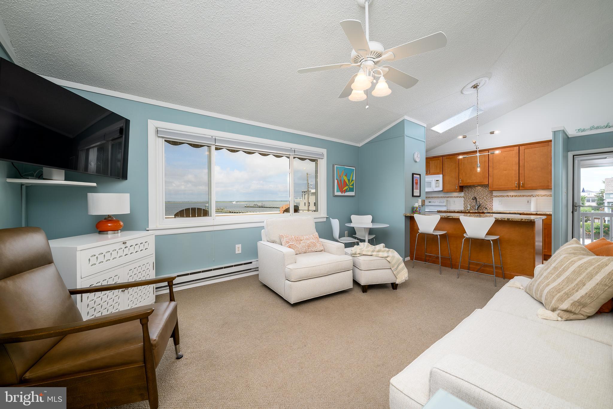 24 Joan Road Long Beach Township, NJ 08008 - Photo 13 of 66 a bedroom with furniture and a large window