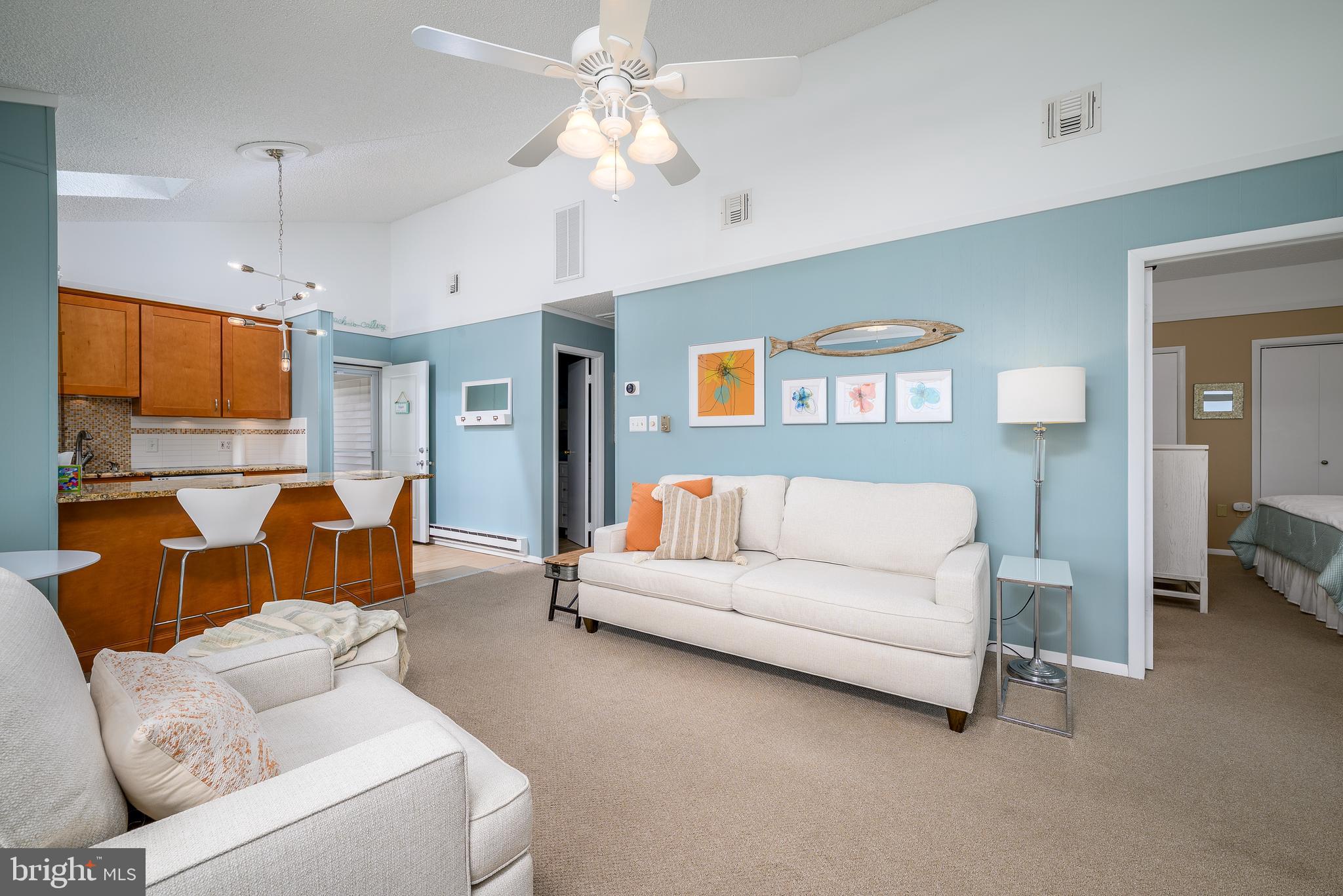 24 Joan Road Long Beach Township, NJ 08008 - Photo 15 of 66 a living room with furniture and a flat screen tv