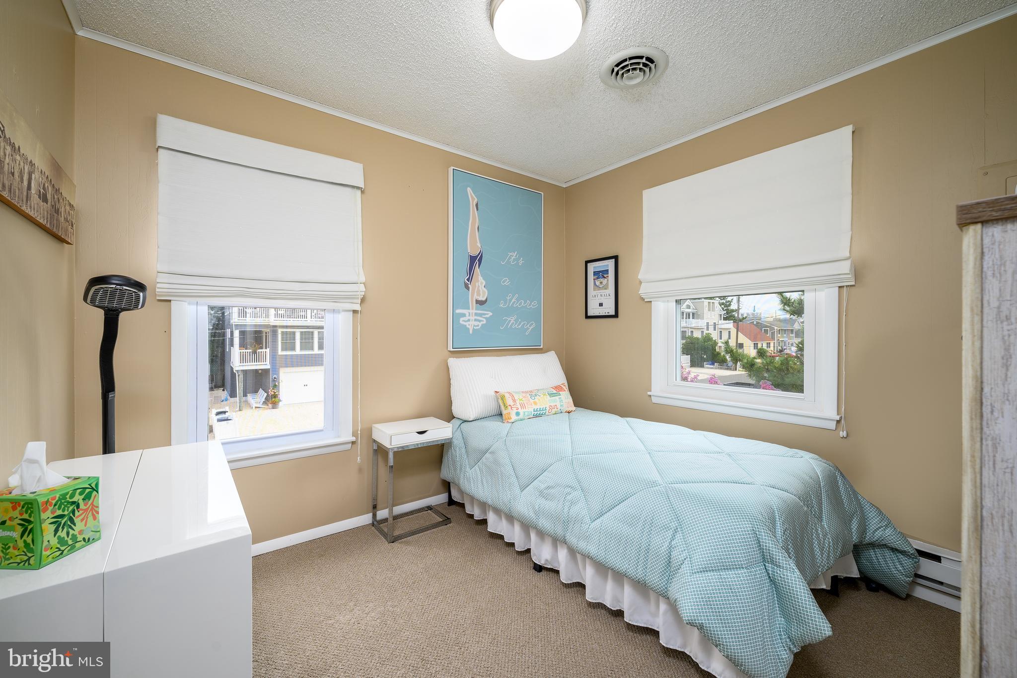 24 Joan Road Long Beach Township, NJ 08008 - Photo 19 of 66 a bedroom with a bed and a painting on the wall