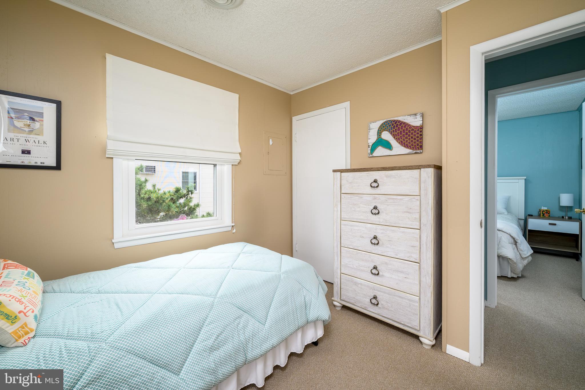 24 Joan Road Long Beach Township, NJ 08008 - Photo 20 of 66 a bedroom with a bed and a window