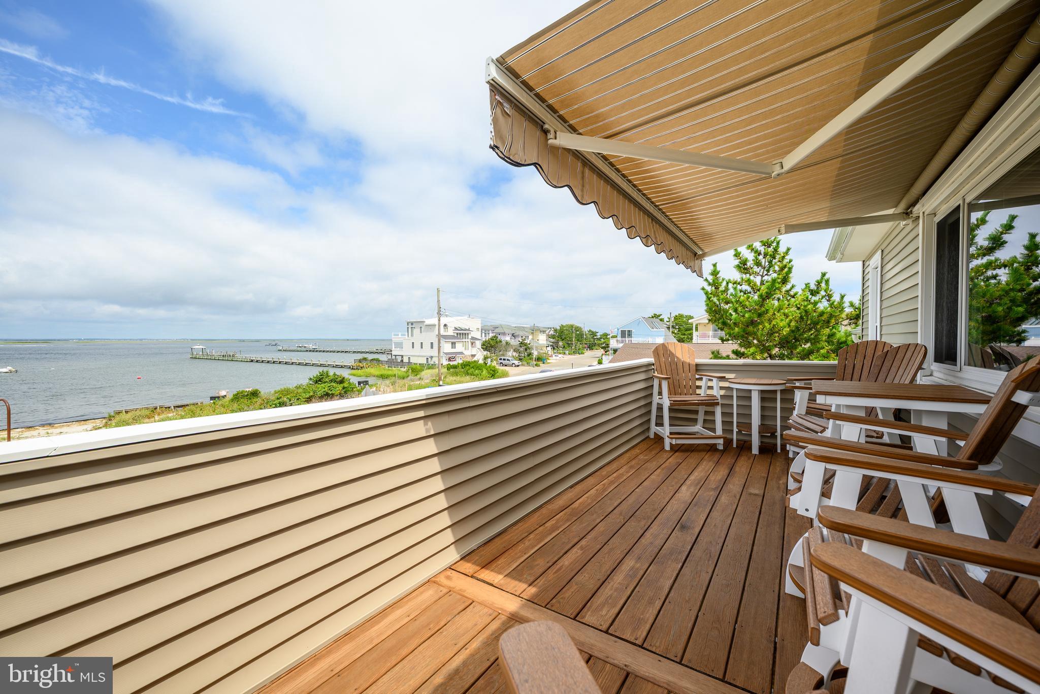 24 Joan Road Long Beach Township, NJ 08008 - Photo 2 of 66 a view of a balcony with chairs