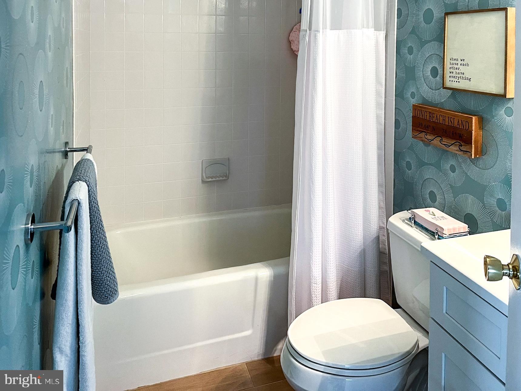 24 Joan Road Long Beach Township, NJ 08008 - Photo 24 of 66 a white toilet sitting next to a bath tub