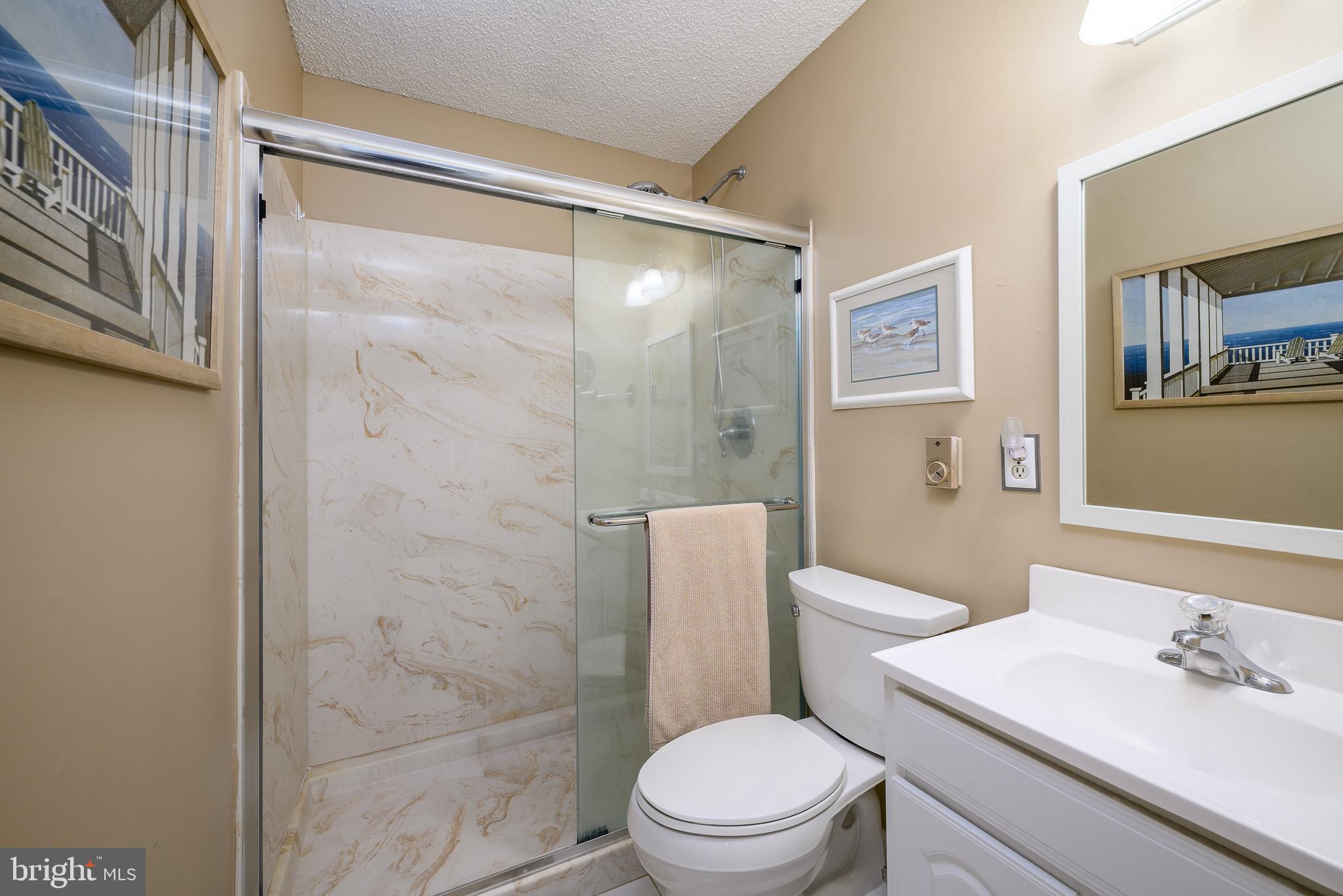 24 Joan Road Long Beach Township, NJ 08008 - Photo 29 of 66 a white toilet sitting next to a bathroom sink
