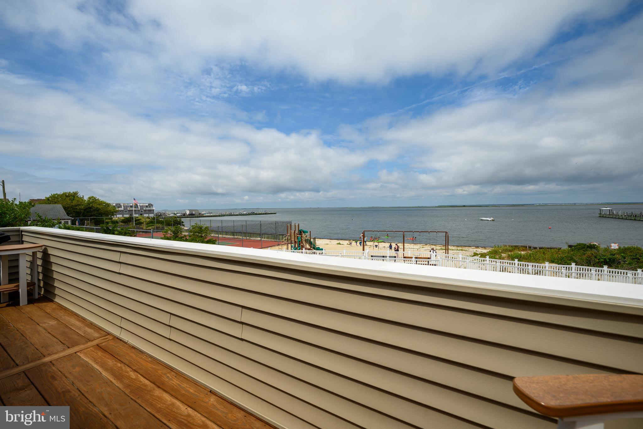 24 Joan Road Long Beach Township, NJ 08008 - Photo 33 of 66 a view of city and sky from a balcony