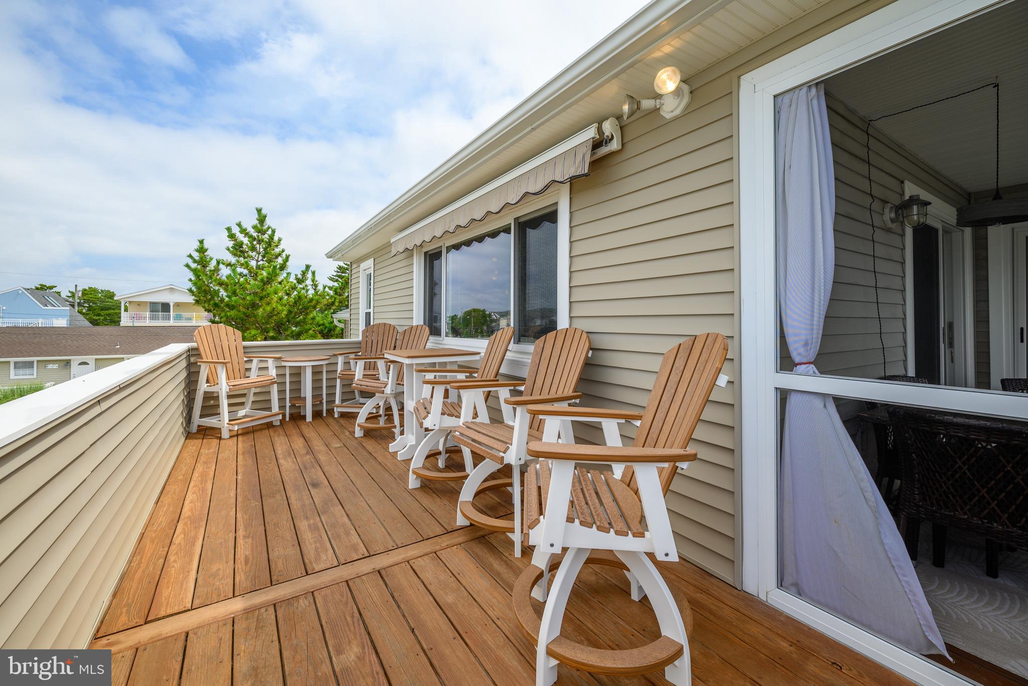 24 Joan Road Long Beach Township, NJ 08008 - Photo 36 of 66 a balcony with table and chairs