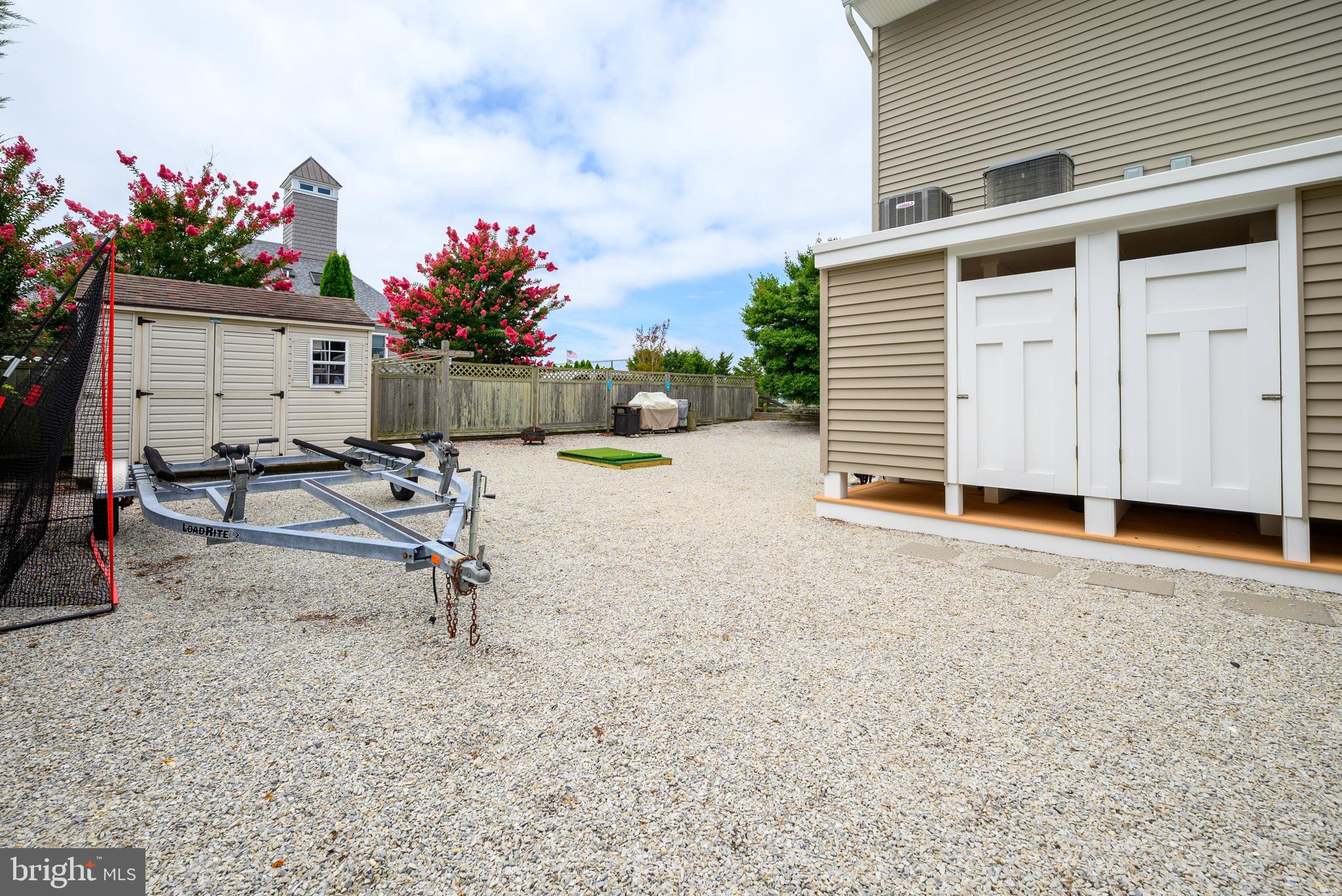 24 Joan Road Long Beach Township, NJ 08008 - Photo 39 of 66 a view of a house with a backyard and a porch