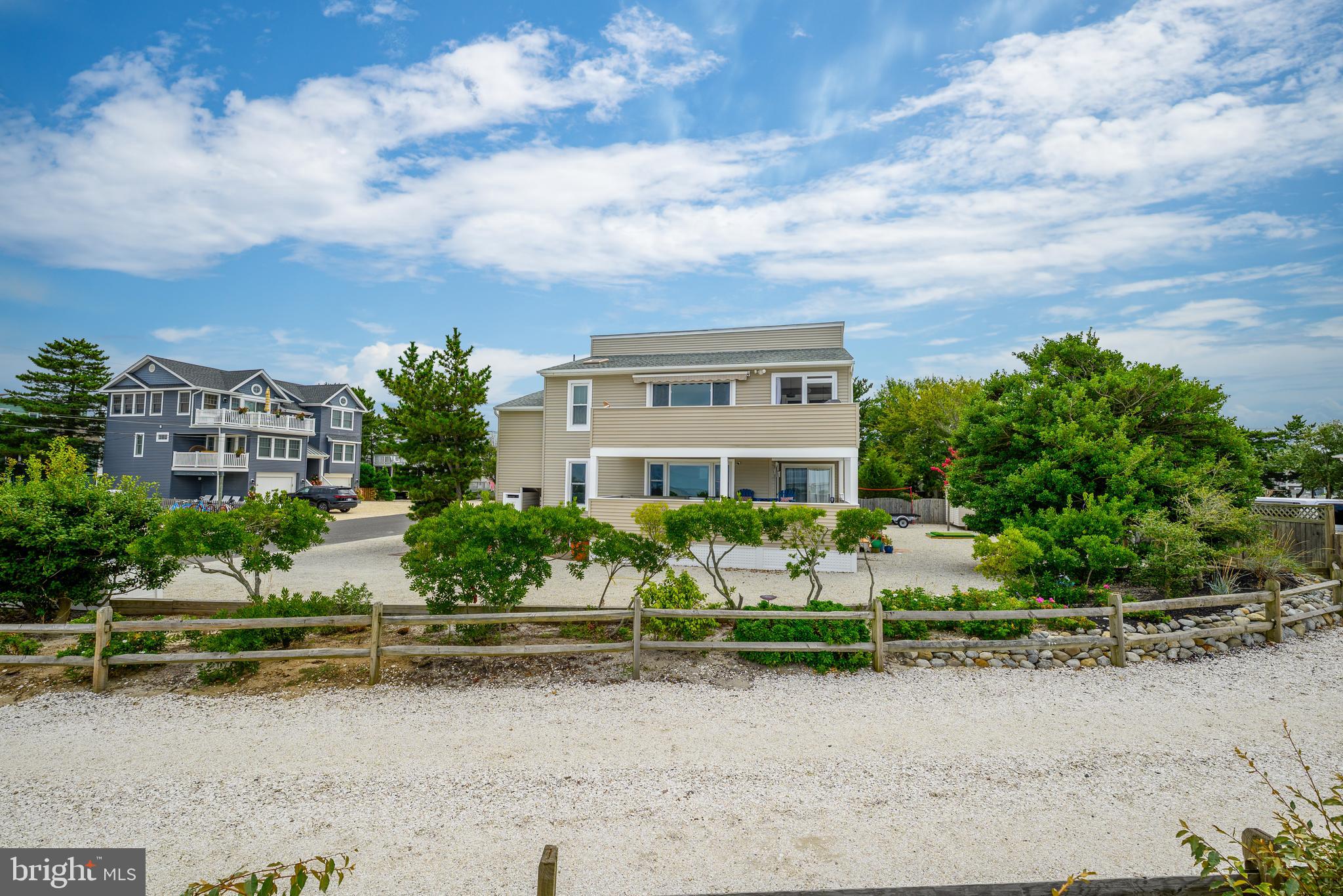 24 Joan Road Long Beach Township, NJ 08008 - Photo 4 of 66 front view of a house with a street