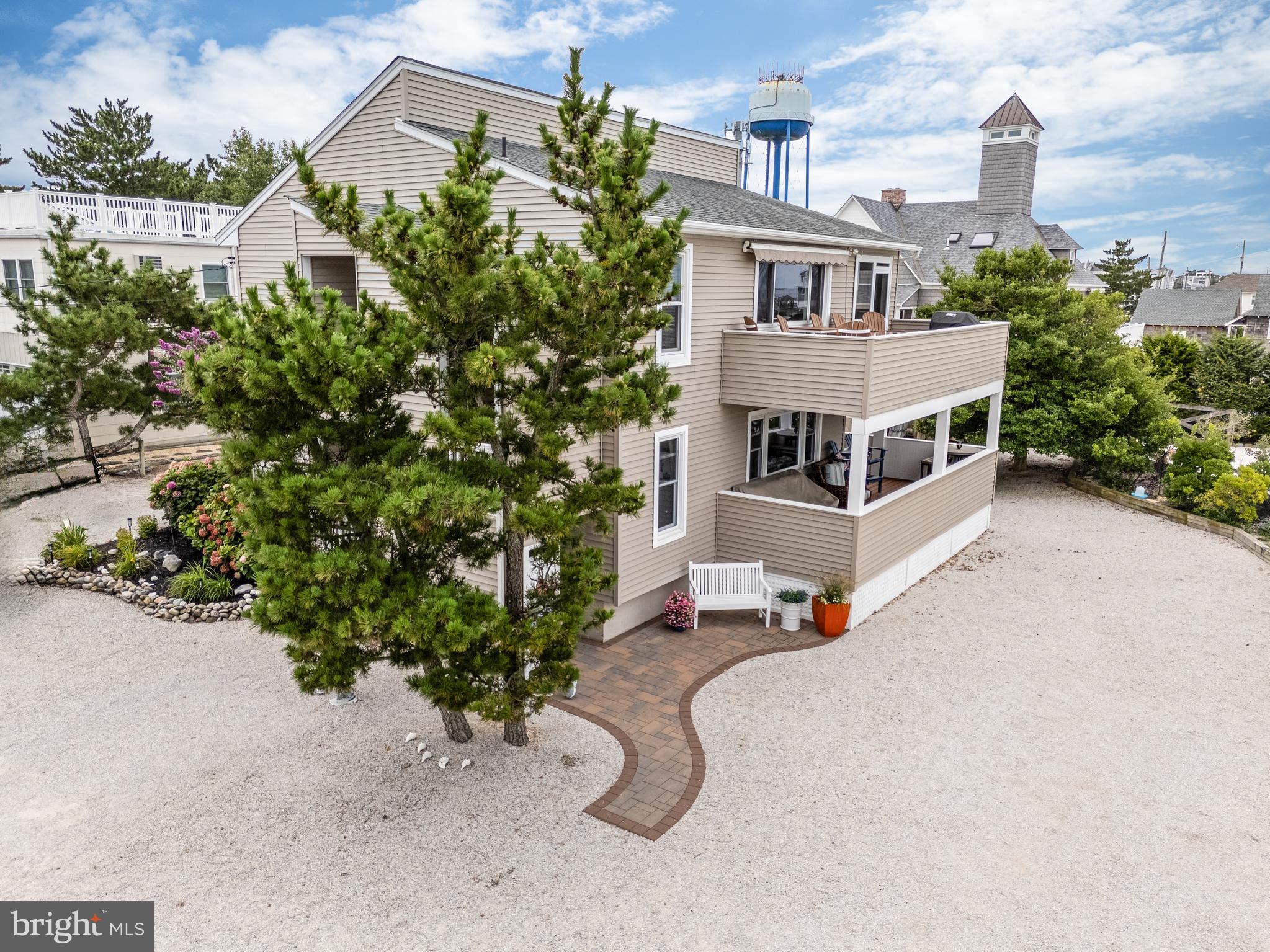 24 Joan Road Long Beach Township, NJ 08008 - Photo 5 of 66 an aerial view of a house with a yard and sitting area