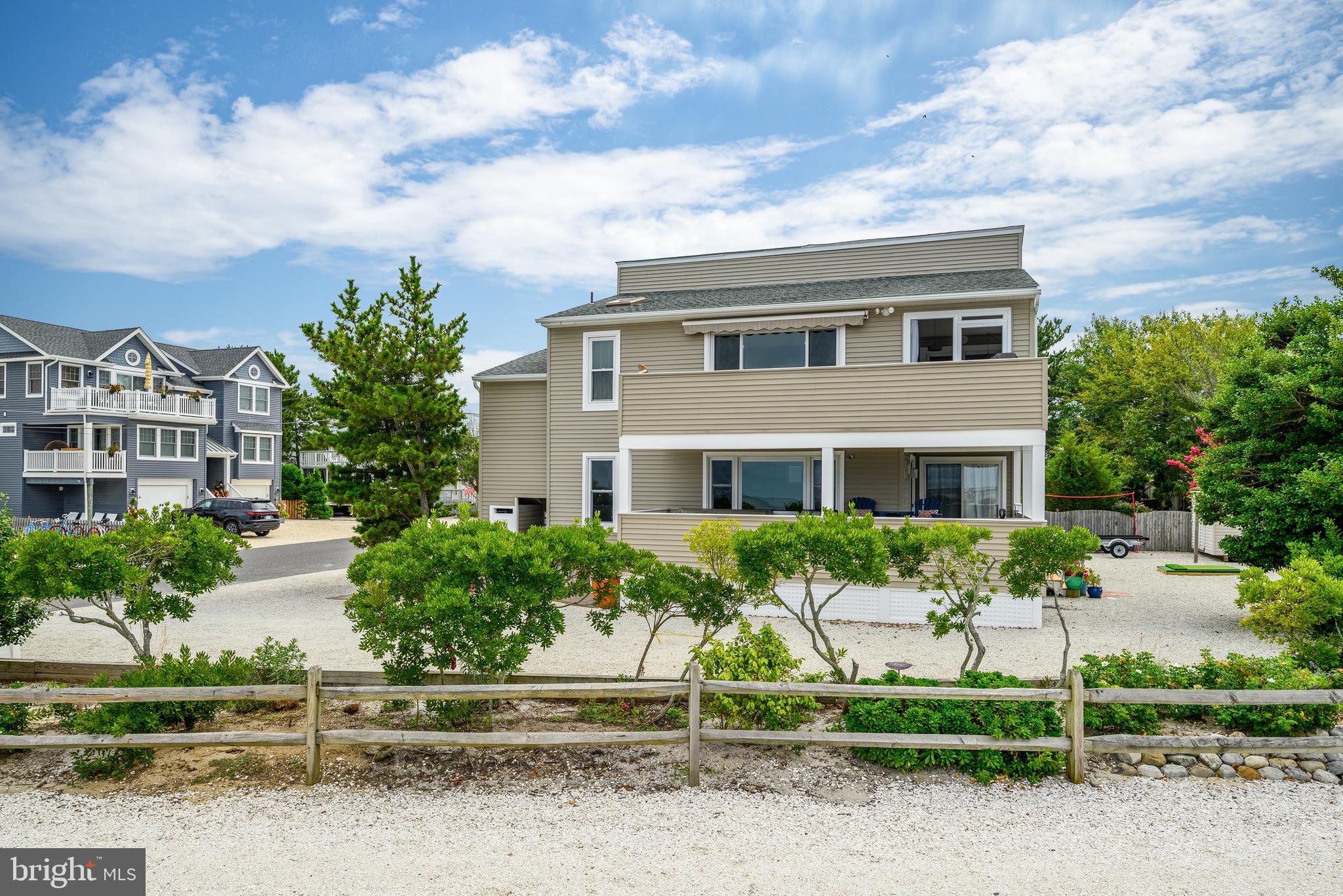 24 Joan Road Long Beach Township, NJ 08008 - Photo 6 of 66 a front view of a house with a yard