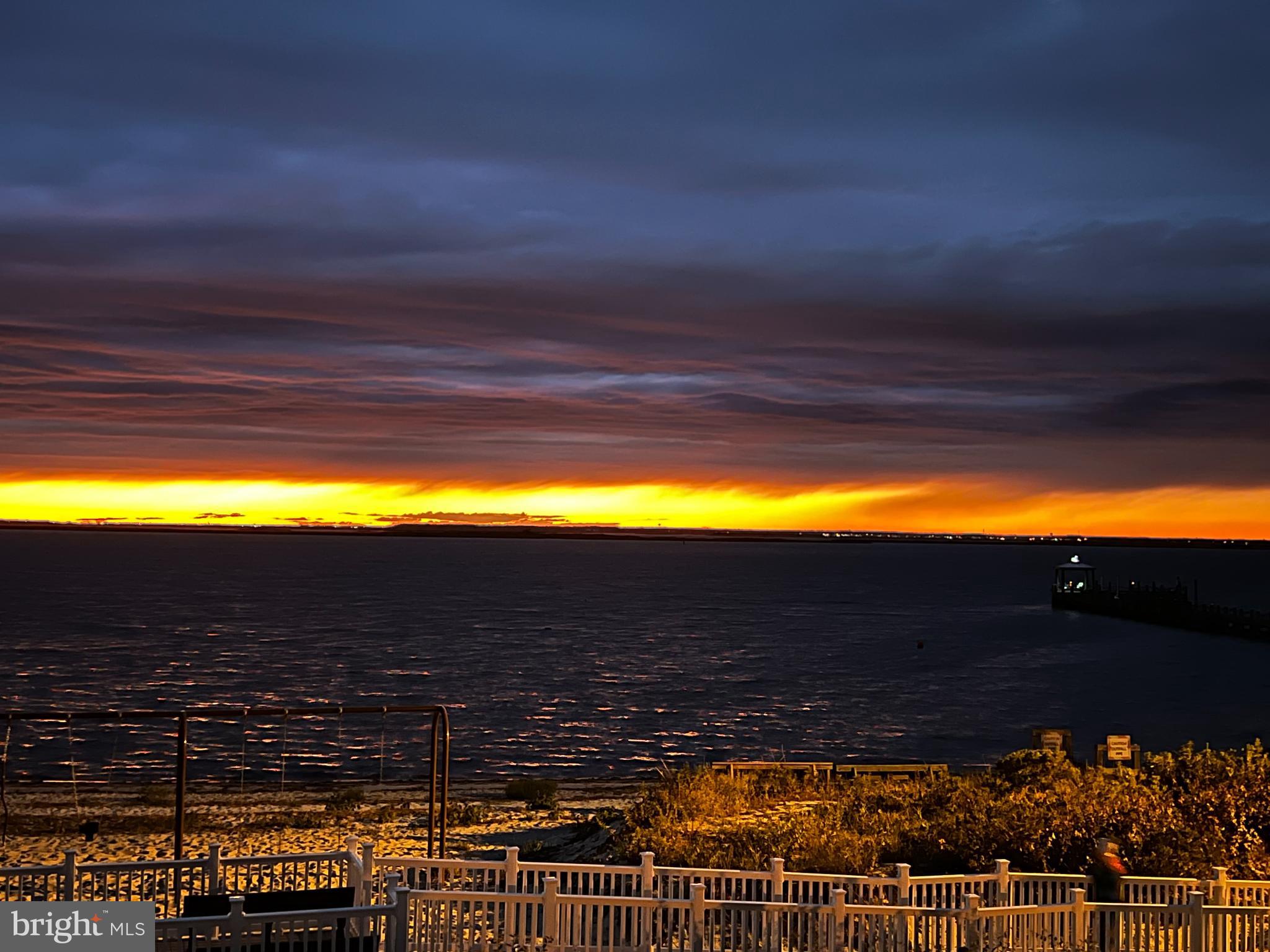 24 Joan Road Long Beach Township, NJ 08008 - Photo 62 of 66 a view of balcony with two chairs and a potted plant