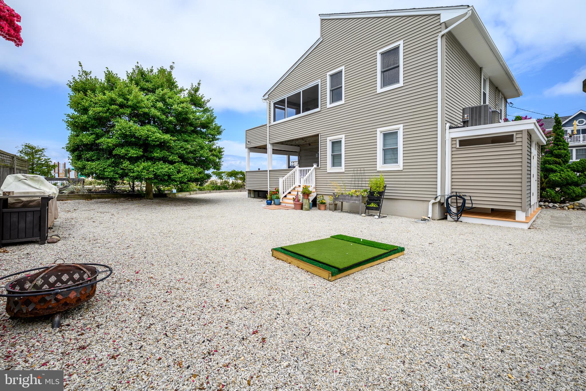 24 Joan Road Long Beach Township, NJ 08008 - Photo 7 of 66 a view of a house with backyard and sitting area