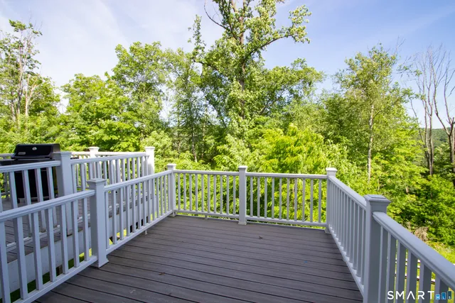 a living room with furniture a window and a chandelier