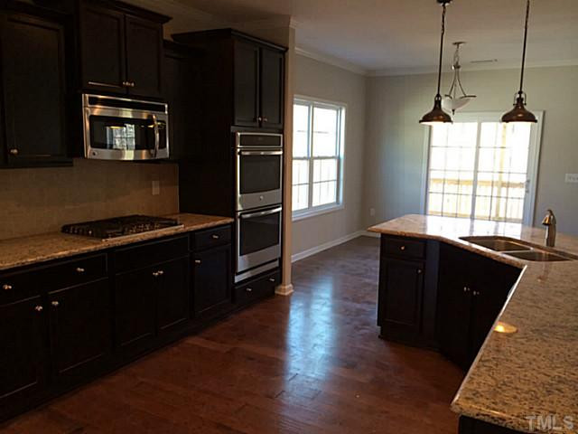 109 Strolling Way Durham, NC 27707 - Photo 3 of 16 Gourmet kitchen with upgraded granite and hardwoods!