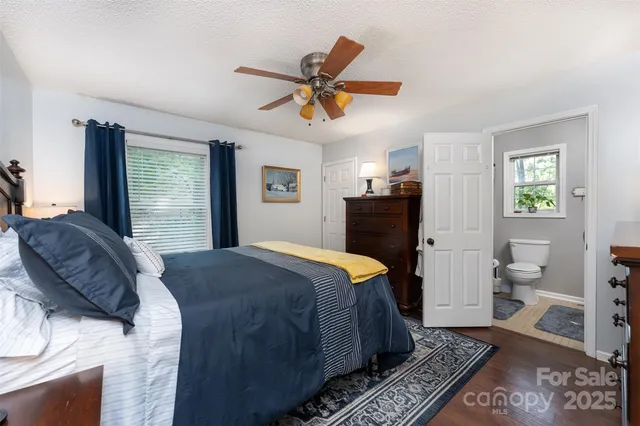 a bed room with a bed and a window