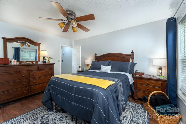 a bedroom with a bed and a dresser in it