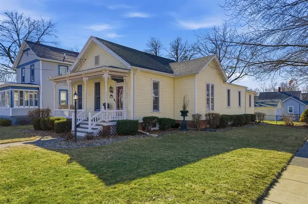 a front view of a house with garden