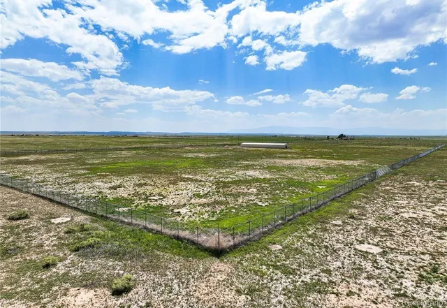 a view of an ocean and a yard