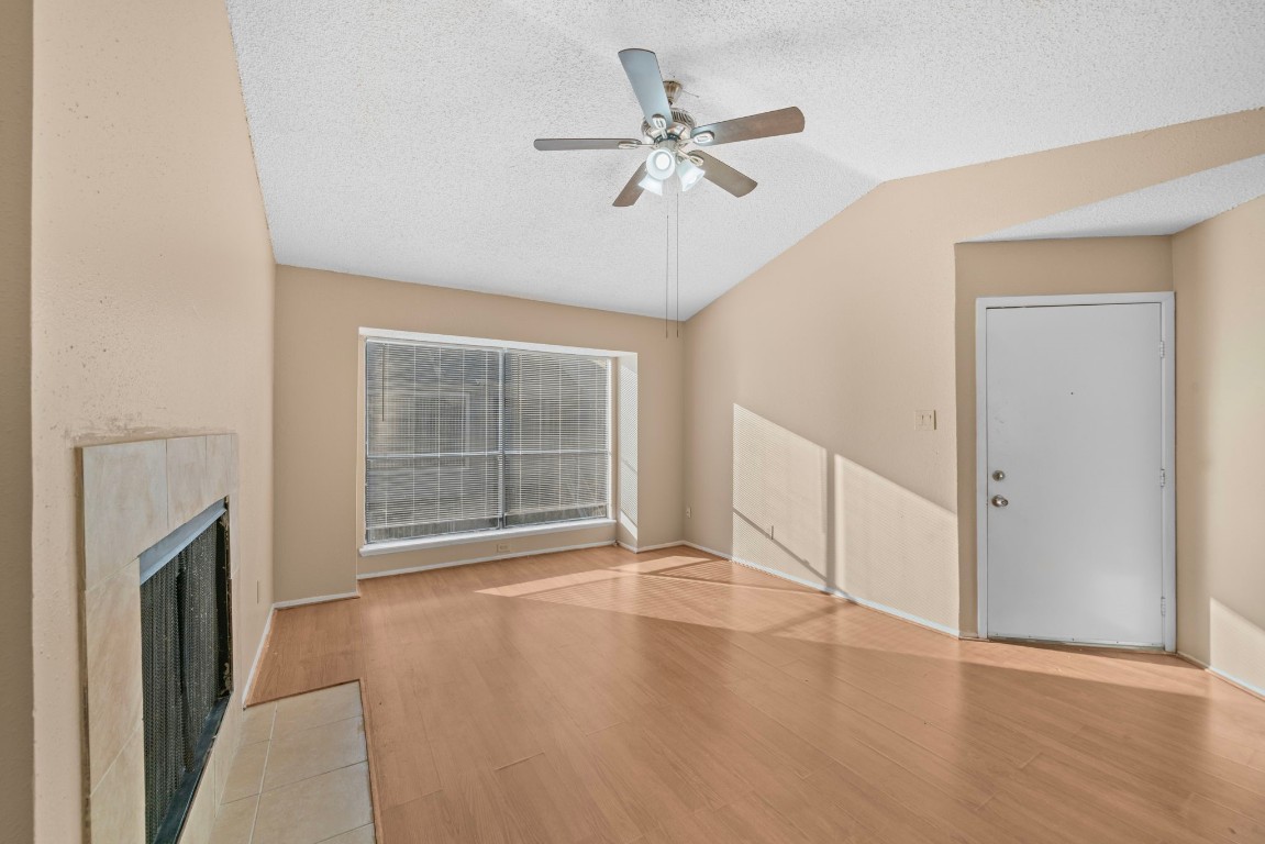 6701 Sands Point Drive, Unit 82 Houston, TX 77074 - Photo 4 of 23 a view of an empty room with wooden floor and a window