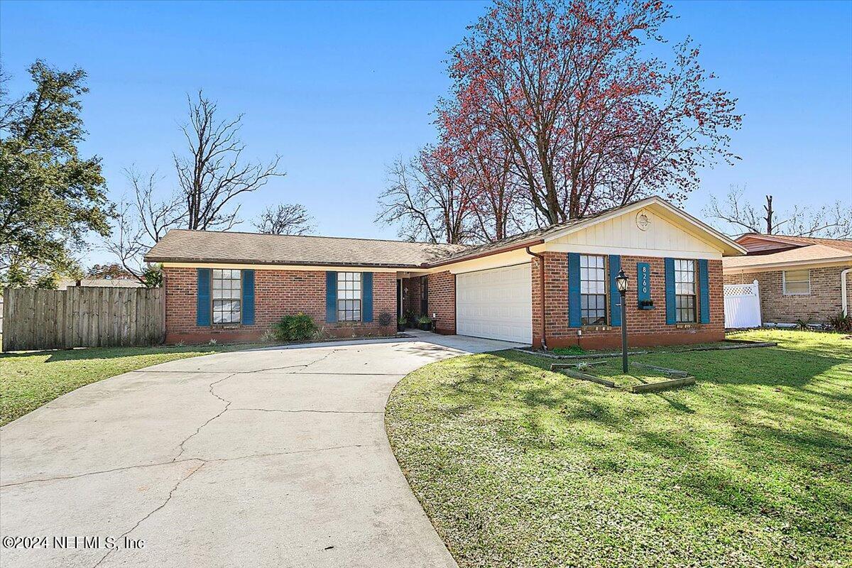 8260 Springtree Road Jacksonville, FL 32210 - Photo 1 of 18 02-Exterior Front