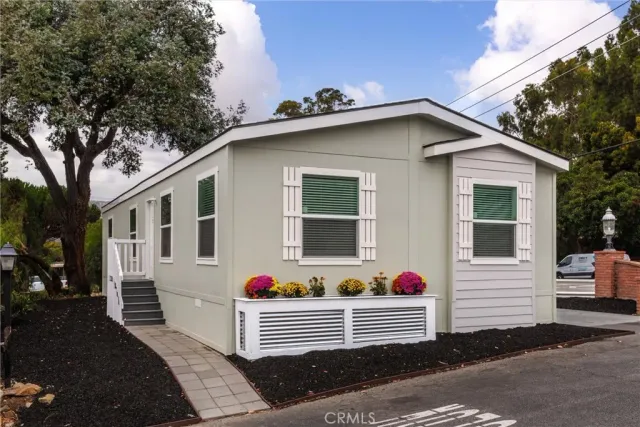 a front view of a house with yard