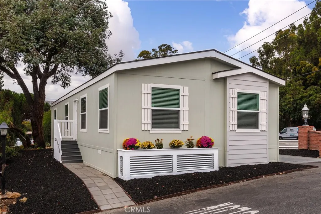 a front view of a house with yard