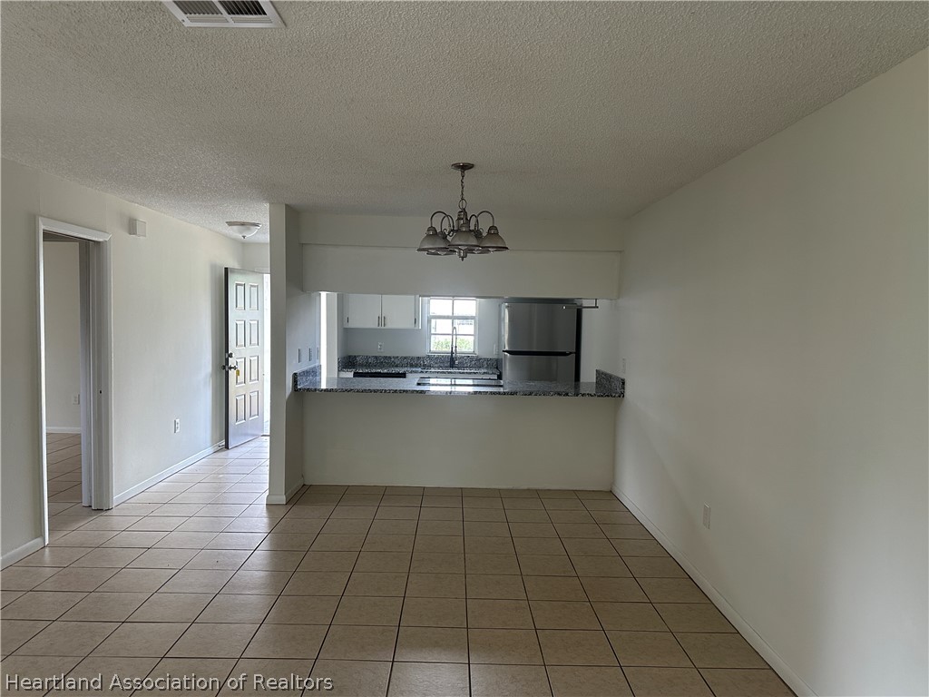 237 Rhapsody Avenue Lake Placid, FL 33852 - Photo 17 of 18 a view of a kitchen with a sink and cabinets