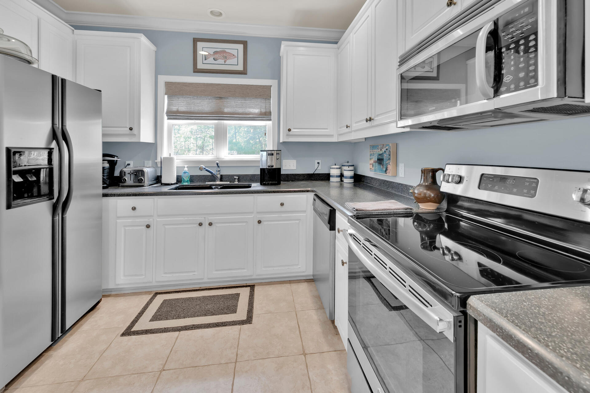 183 Hidden Lake Way Santa Rosa Beach, FL 32459 - Photo 11 of 50 a kitchen that has a sink and stainless steel appliances