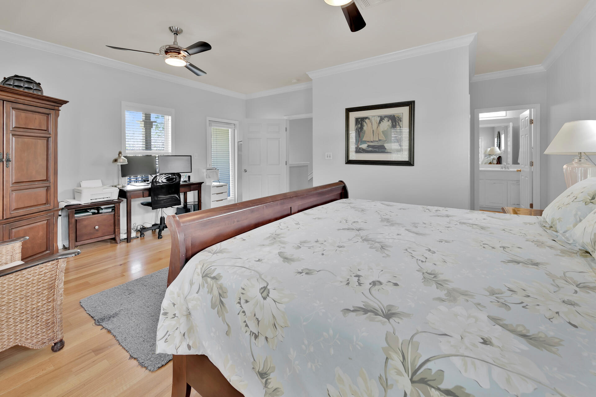 183 Hidden Lake Way Santa Rosa Beach, FL 32459 - Photo 14 of 50 a bedroom with a large bed and a chandelier
