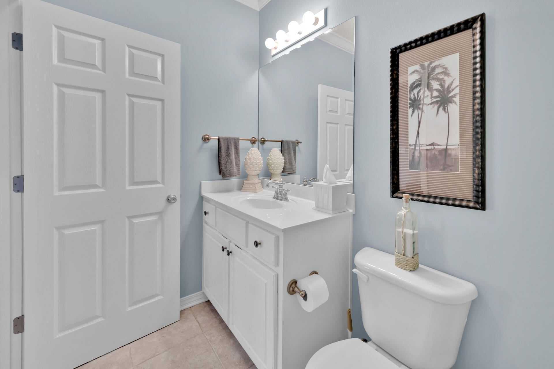 183 Hidden Lake Way Santa Rosa Beach, FL 32459 - Photo 16 of 50 a bathroom with a toilet sink and mirror