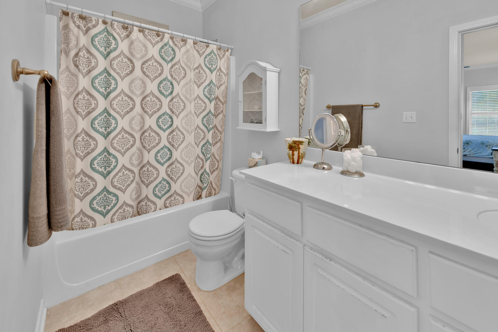 183 Hidden Lake Way Santa Rosa Beach, FL 32459 - Photo 18 of 50 a bathroom with a toilet sink and mirror