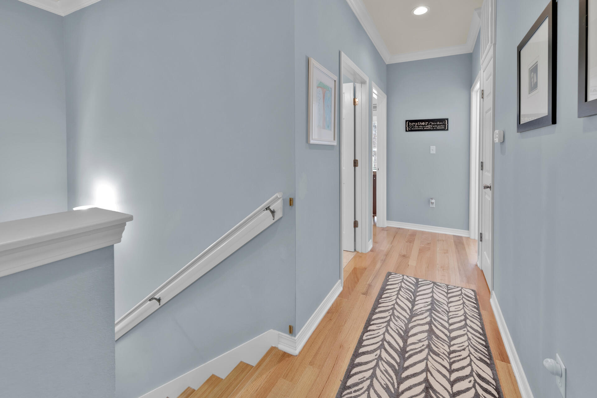 183 Hidden Lake Way Santa Rosa Beach, FL 32459 - Photo 19 of 50 a view of hallway with closet and wooden floor