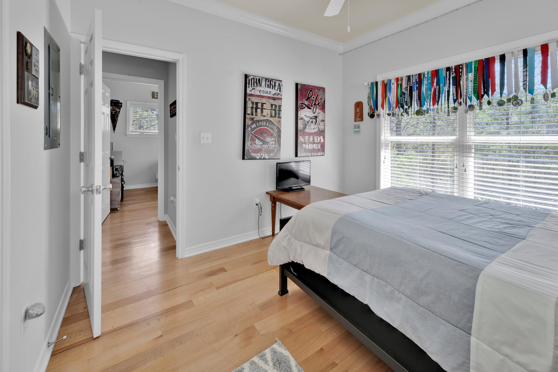 183 Hidden Lake Way Santa Rosa Beach, FL 32459 - Photo 24 of 50 a spacious bedroom with a bed and a book shelf