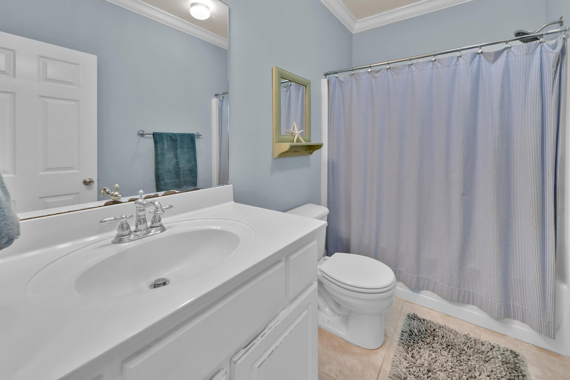 183 Hidden Lake Way Santa Rosa Beach, FL 32459 - Photo 27 of 50 a bathroom with a sink a toilet and shower curtain