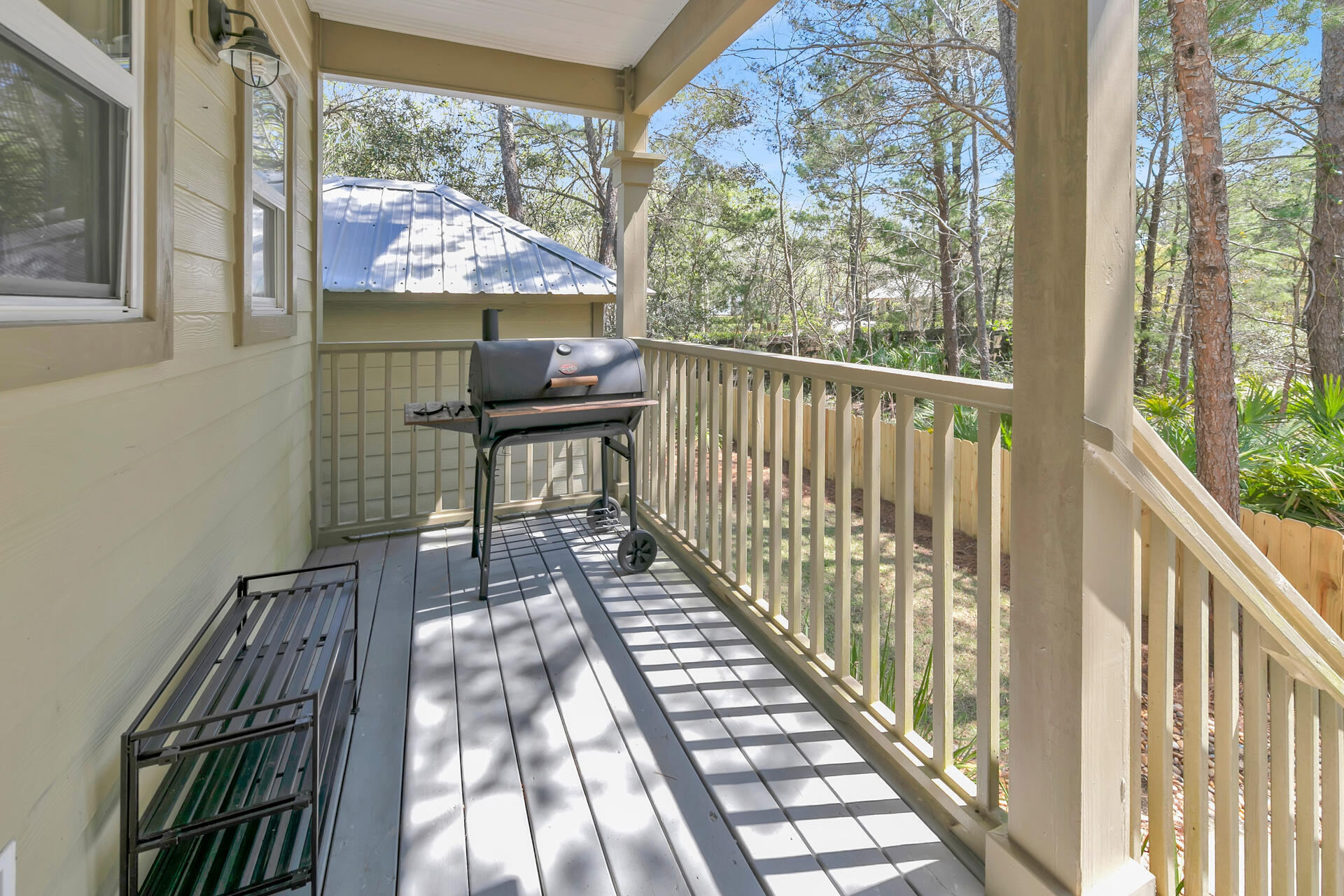 183 Hidden Lake Way Santa Rosa Beach, FL 32459 - Photo 32 of 50 a view of a porch with furniture and wooden floor