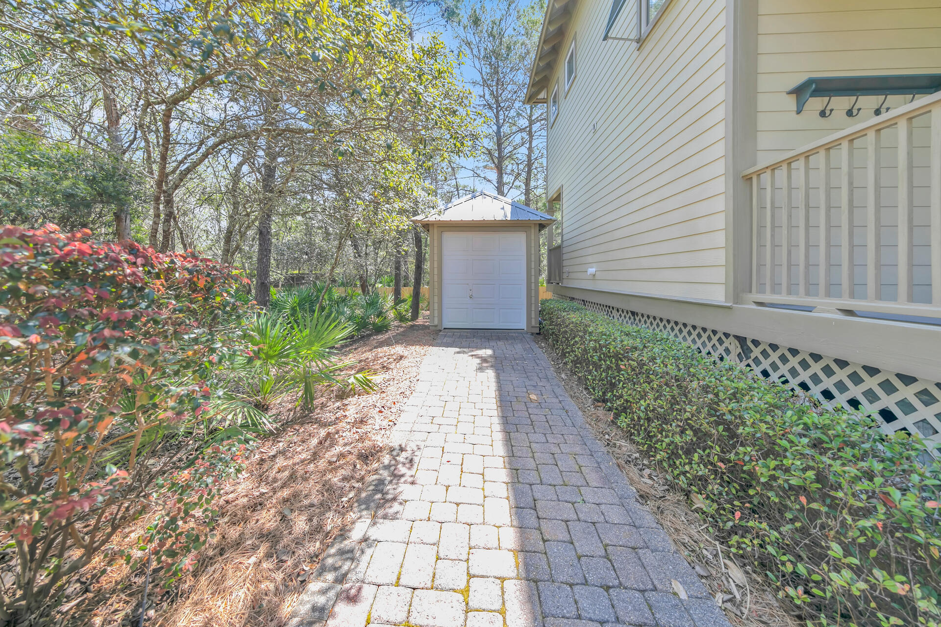 183 Hidden Lake Way Santa Rosa Beach, FL 32459 - Photo 38 of 50 a sidewalk with a white house in front of it