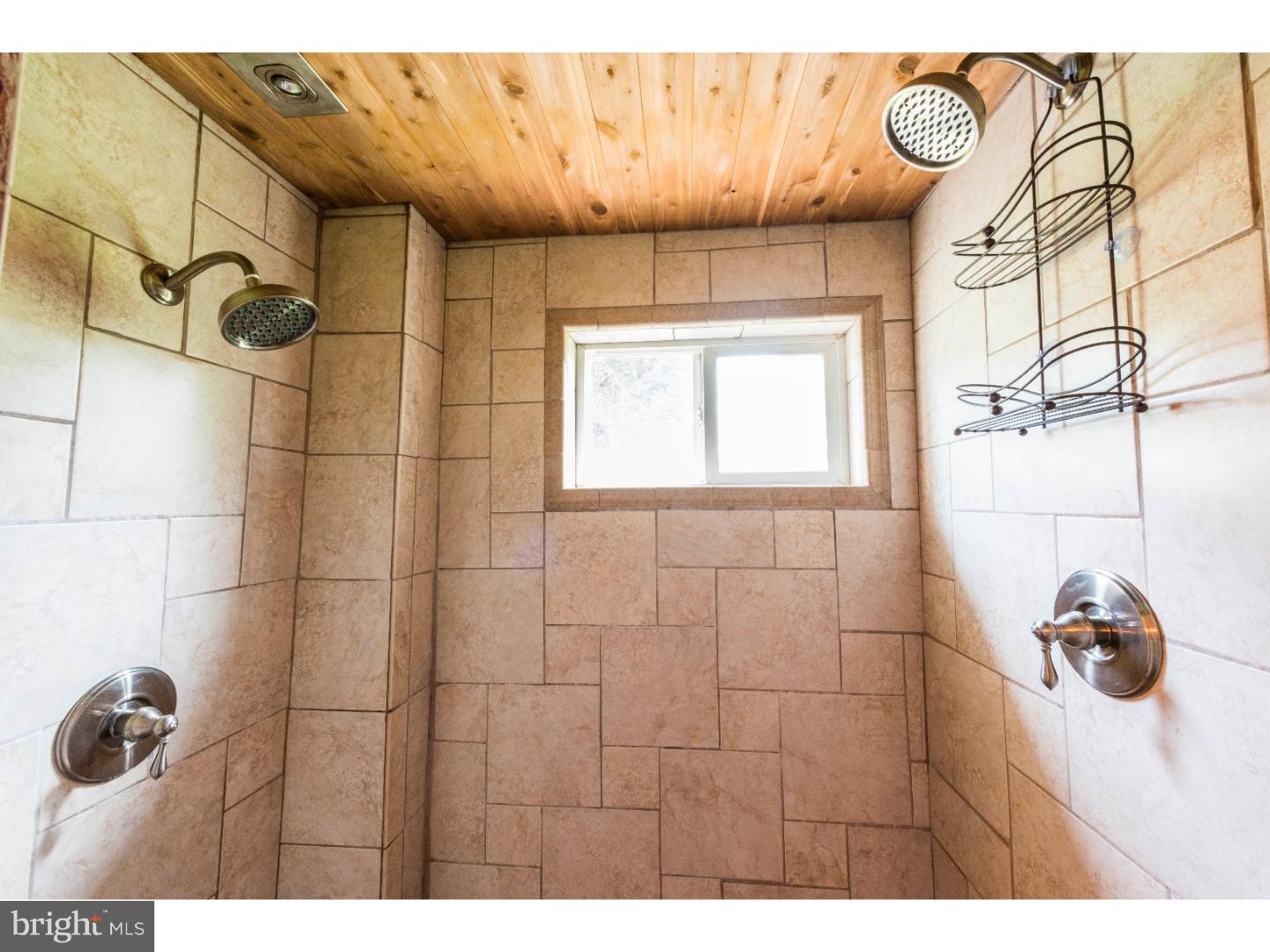 765 Pughtown Road Spring City, PA 19475 - Photo 18 of 21 a bathroom with a window and a shower