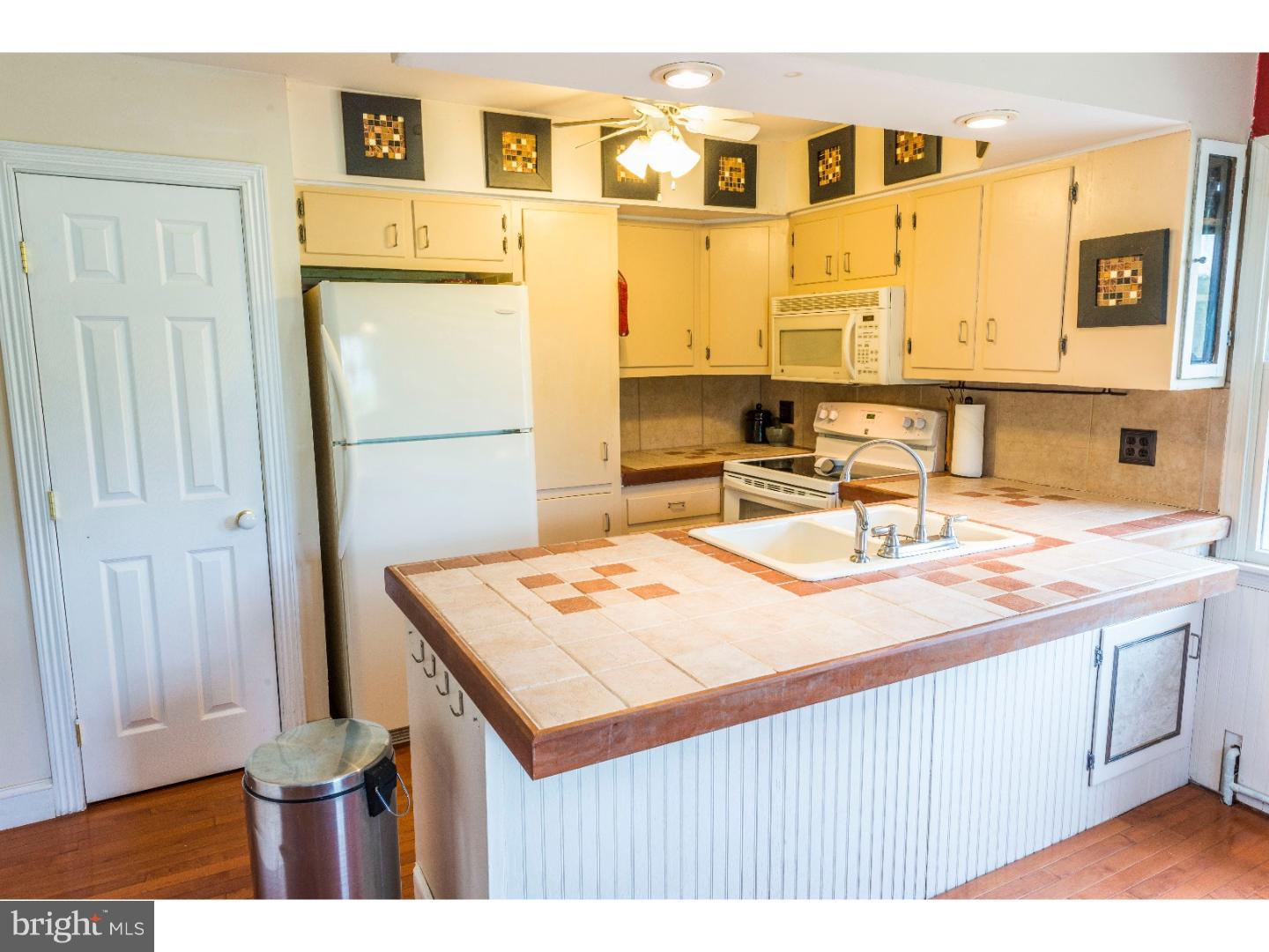 765 Pughtown Road Spring City, PA 19475 - Photo 5 of 21 a room with a sink and a refrigerator