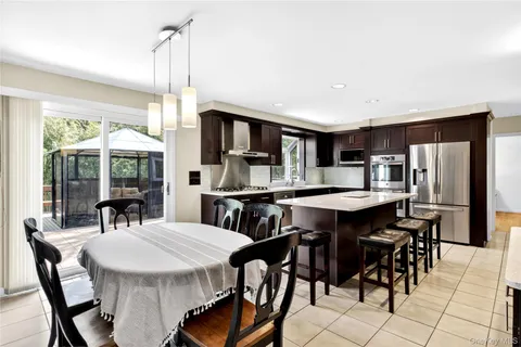 a dinning table and chairs in a room