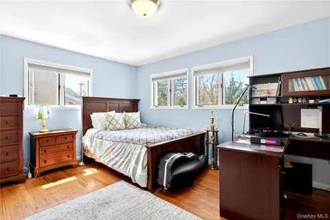 a bedroom with a bed and a desk