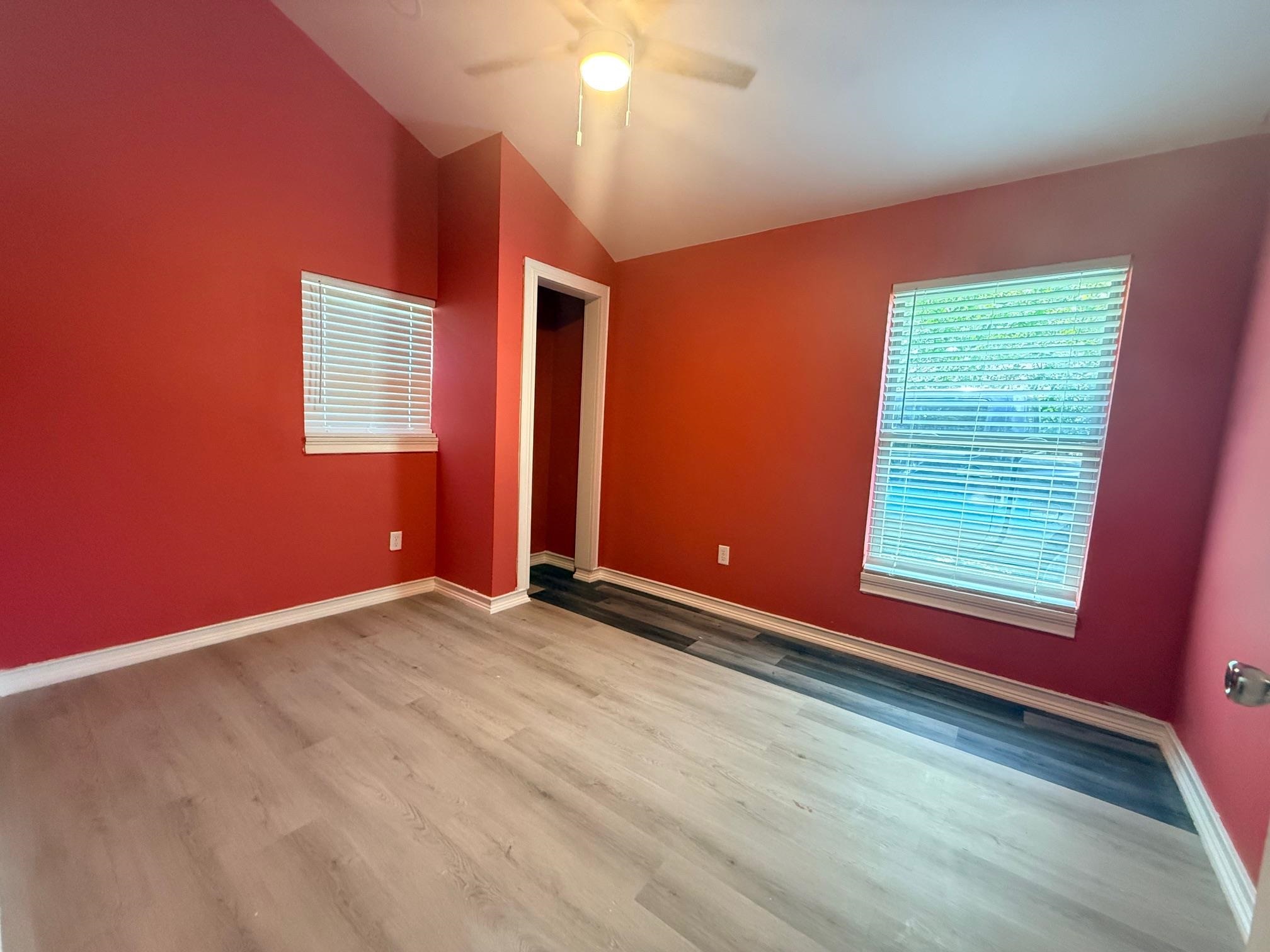 3054 Lotus Road Memphis, TN 38109 - Photo 15 of 29 Spacious interior featuring vaulted ceilings and light wood-finish flooring