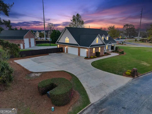 a kitchen with granite countertop white cabinets and a stainless steel appliances