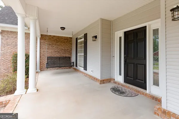 a bathroom with a sink a mirror and a toilet