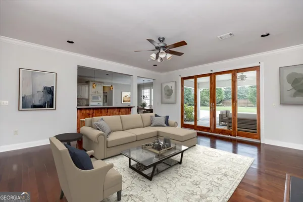 a kitchen with refrigerator cabinets and wooden floor