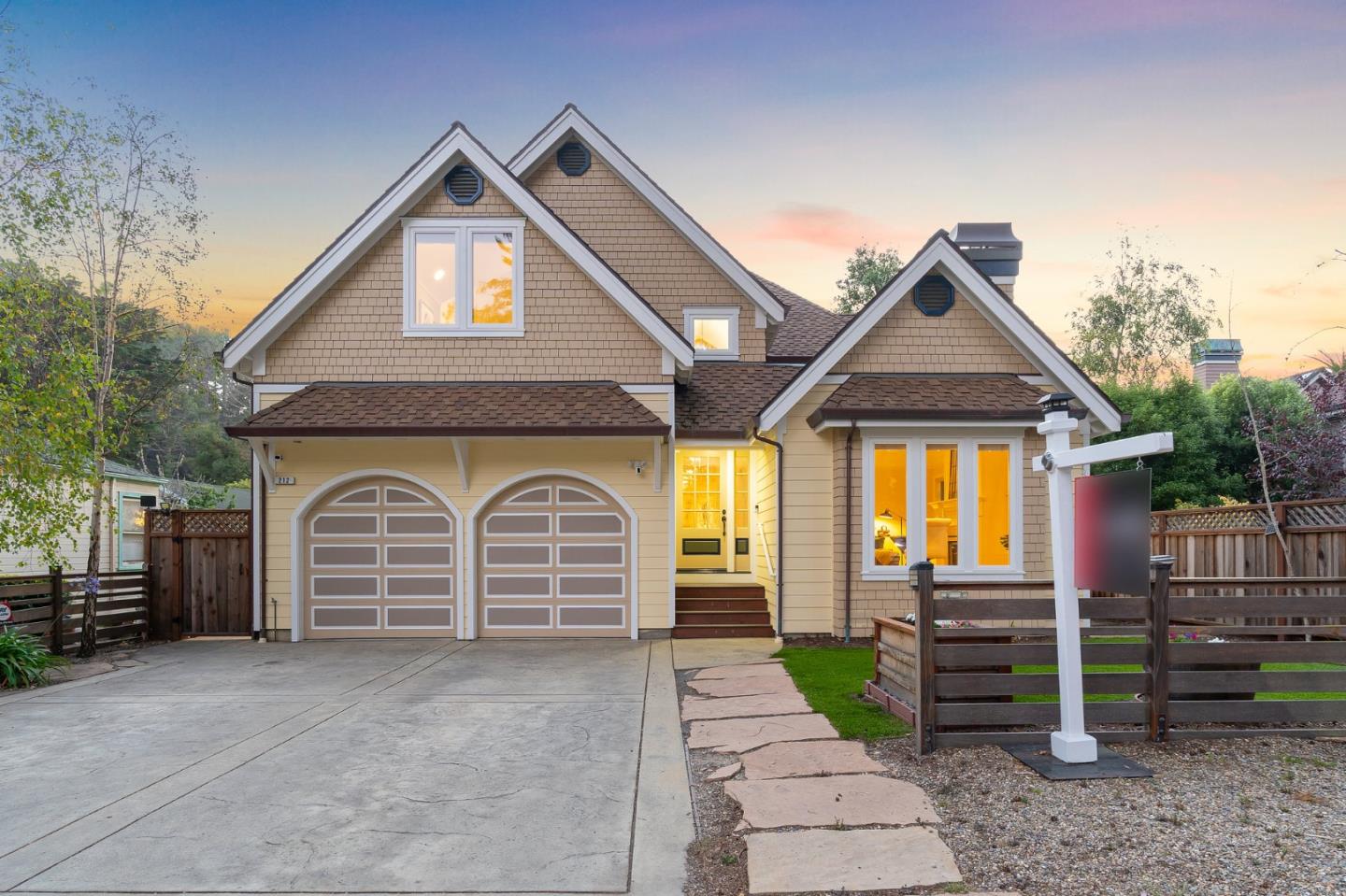 a front view of a house with a garage